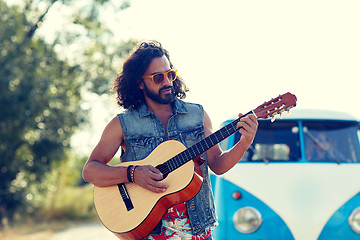 Image showing hippie man playing guitar over minivan car outdoor