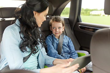 Image showing happy family with tablet pc driving in car