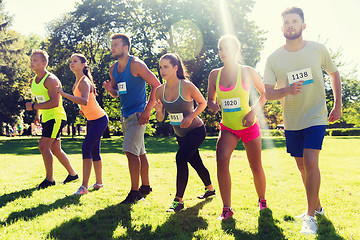 Image showing sportsmen with badge numbers on start of race