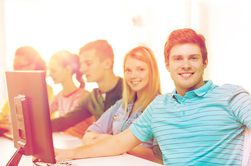 Image showing male student with classmates in computer class