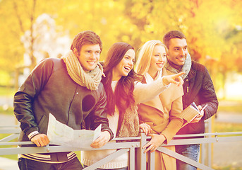 Image showing couples with tourist map in autumn park