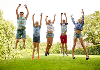 Image showing happy kids jumping and having fun in summer park