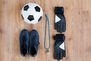 Image showing close up of soccer ball, boots, whistle and gloves