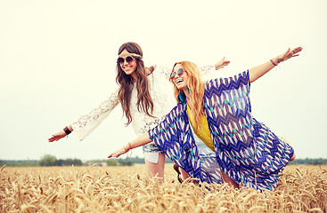 Image showing happy hippie women having fun on cereal field