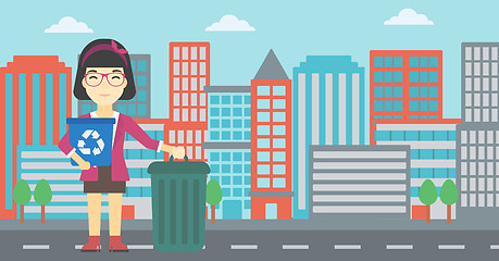 Image showing Woman with recycle bin and trash can.