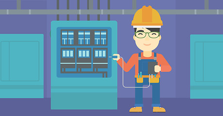 Image showing Electrician with electrical equipment.