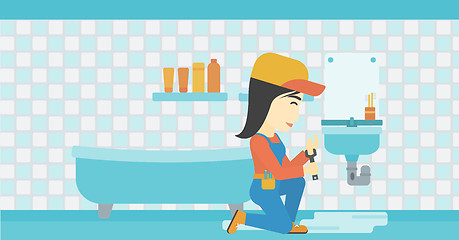 Image showing Woman repairing sink.
