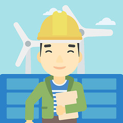 Image showing Male worker of solar power plant and wind farm.