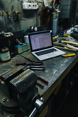 Image showing View of old tools,laptop and phone on table