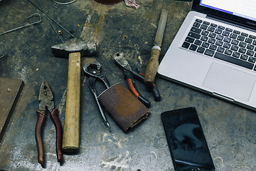 Image showing Top view of old tools,laptop and phone on table