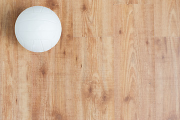 Image showing close up of volleyball ball on wooden floor