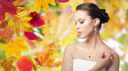 Image showing beautiful asian woman with earring and pendant