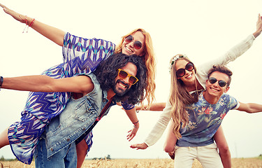 Image showing happy hippie friends having fun on cereal field