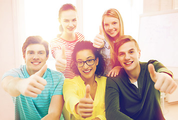 Image showing smiling students at school showing thumbs up