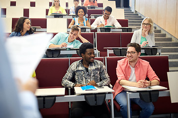 Image showing group of students with notebooks at lecture hall