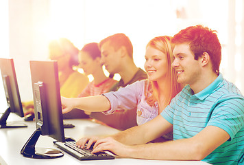 Image showing smiling students in computer class at school