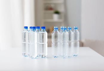 Image showing close up of bottles with drinking water on table