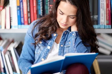 Image showing high school student girl reading book at library