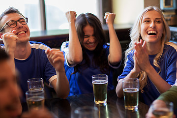 Image showing football fans or friends with beer at sport bar