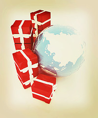 Image showing Traditional Christmas gifts and earth. Global holiday concept . 