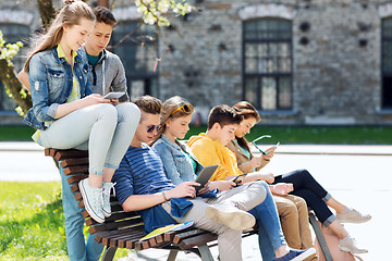 Image showing group of students with tablet pc at school yard