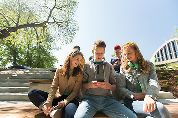 Image showing happy teenage friends with smartphones outdoors