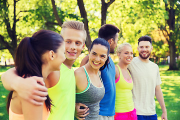 Image showing group of happy friends or sportsmen outdoors