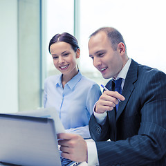 Image showing businessman and businesswoman having discussion