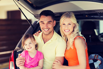 Image showing happy family with hatchback car at home parking