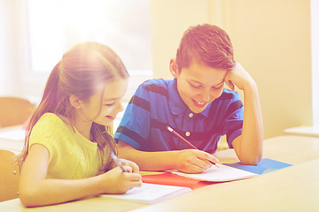 Image showing group of school kids writing test in classroom