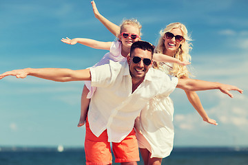 Image showing happy family having fun on summer beach