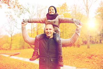 Image showing happy family having fun in autumn park