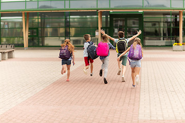 Image showing group of happy elementary school students running