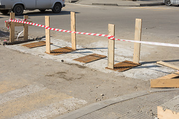 Image showing Installing spillway gratings on the road