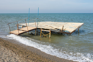 Image showing Break a small wooden pier on the seashore