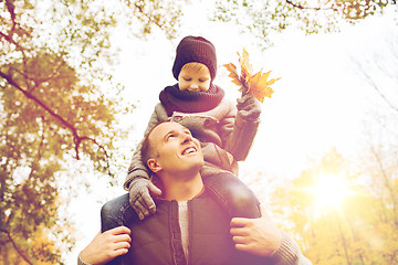 Image showing happy family having fun in autumn park