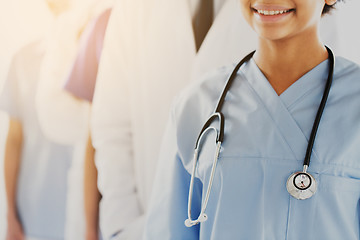 Image showing close up of happy doctor or nurse with stethoscope