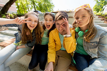 Image showing happy teenage students or friends having fun