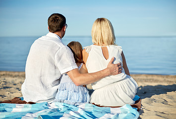 Image showing happy family hugging on summer beach