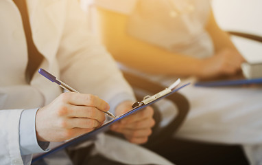 Image showing close up of happy doctors at seminar or hospital