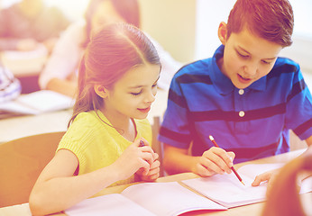 Image showing group of school kids writing test in classroom