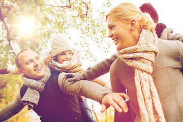 Image showing happy family having fun in autumn park