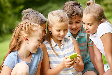 Image showing kids or friends with smartphone in summer park