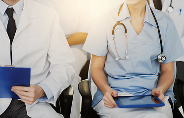 Image showing close up of happy doctors at seminar or hospital