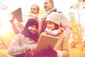 Image showing happy family with tablet pc in autumn park