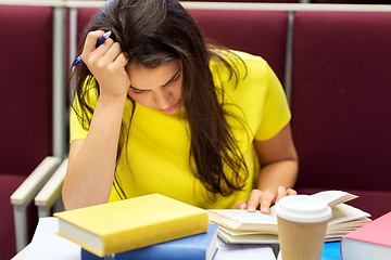 Image showing student girl with books and coffee on lecture