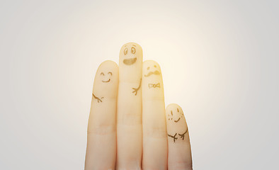 Image showing close up of hands and fingers with smiley faces