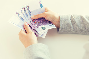 Image showing close up of woman hands counting euro money