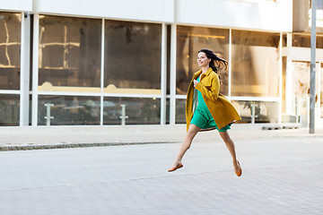 Image showing happy young woman or teenage girl on city street