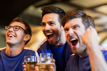 Image showing football fans or friends with beer at sport bar